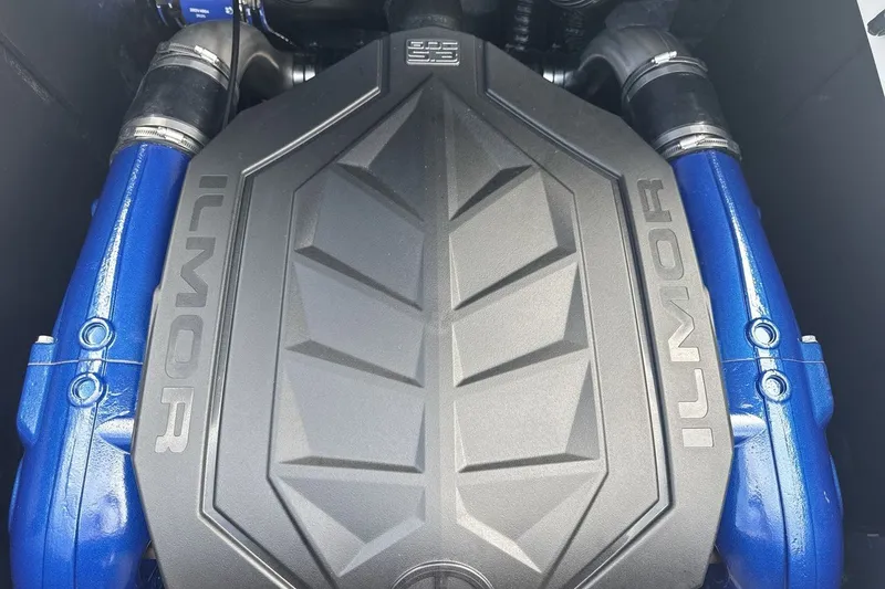 Slide: The Image of Close-up of an Ilmor engine with blue components in a MasterCraft NXT23 boat. - 20