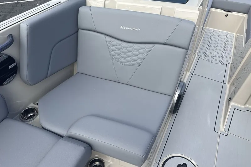 Slide: The Image of The image shows a gray seat in a 2027 MasterCraft NXT23 boat. - 17