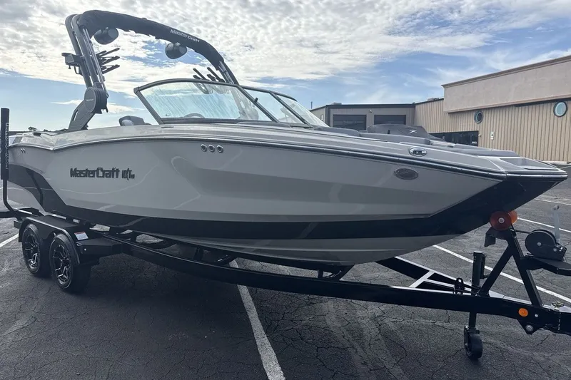Slide: The Image of A modern 2027 MasterCraft NXT23 on a trailer, ready for the water. - 7