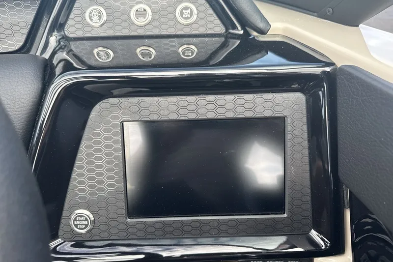Slide: The Image of The image shows the dashboard of a MasterCraft NXT23 boat with a modern display. - 15