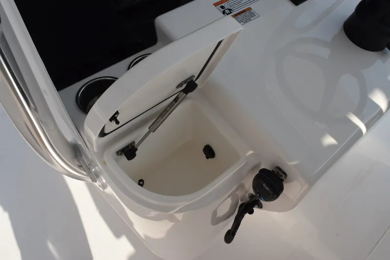 Slide: The Image of Open storage compartment on 2027 Contender 44 ST boat, featuring sleek white design. - 39