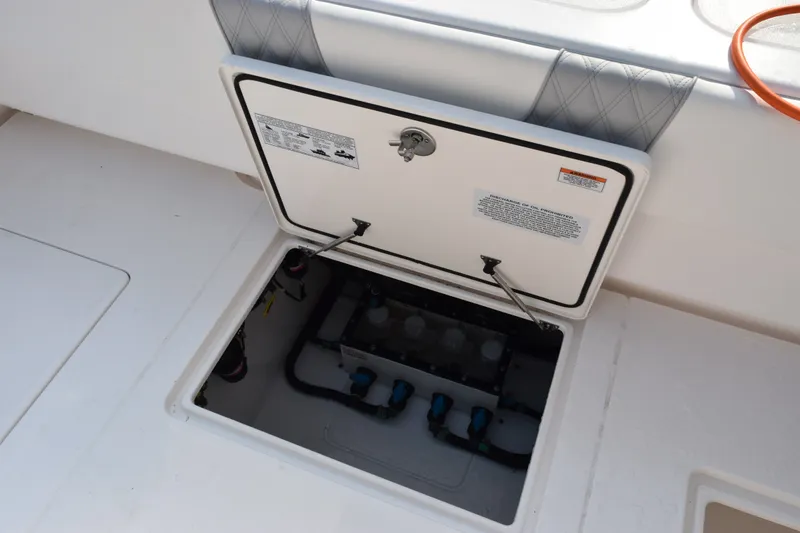 Slide: The Image of Open hatch on 2027 Contender 44 ST boat, revealing internal compartment and components. - 50
