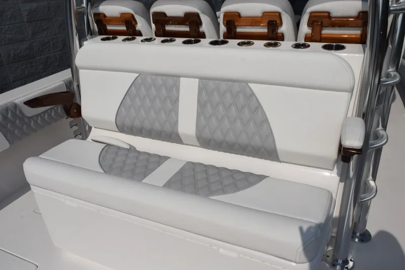 Slide: The Image of Luxury seating on 2027 Contender 44 ST boat with diamond-pattern upholstery. - 7