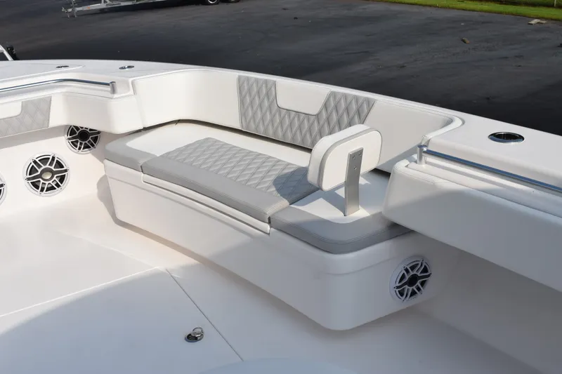 Slide: The Image of Luxurious seating area on 2027 Contender 44 ST boat with stylish upholstery and speakers. - 22