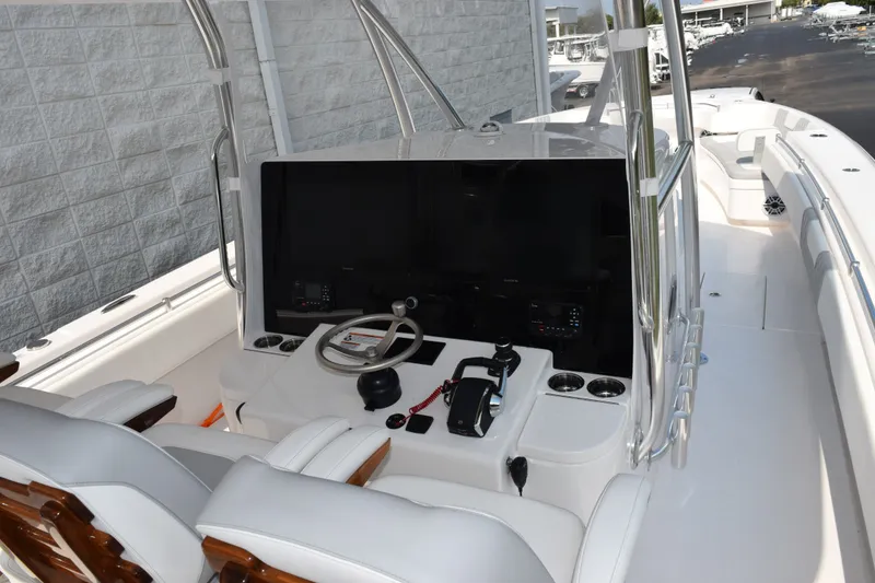 Slide: The Image of 2027 Contender 44 ST boat cockpit with modern controls and seating. - 8