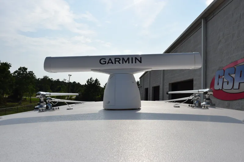 Slide: The Image of Garmin radar on 2027 Contender 44 ST boat, docked near a building. - 20