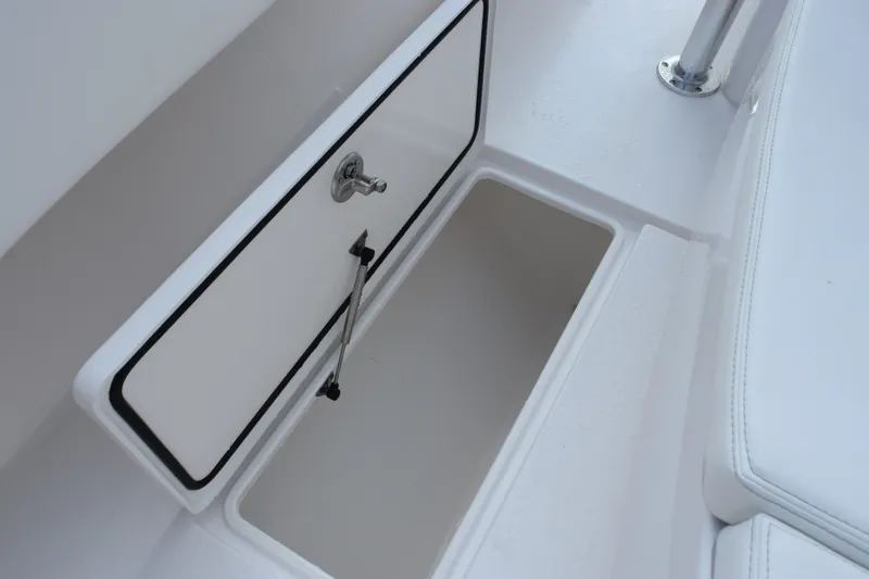 Slide: The Image of Storage compartment on 2027 Contender 44 ST boat, featuring sleek white interior design. - 34
