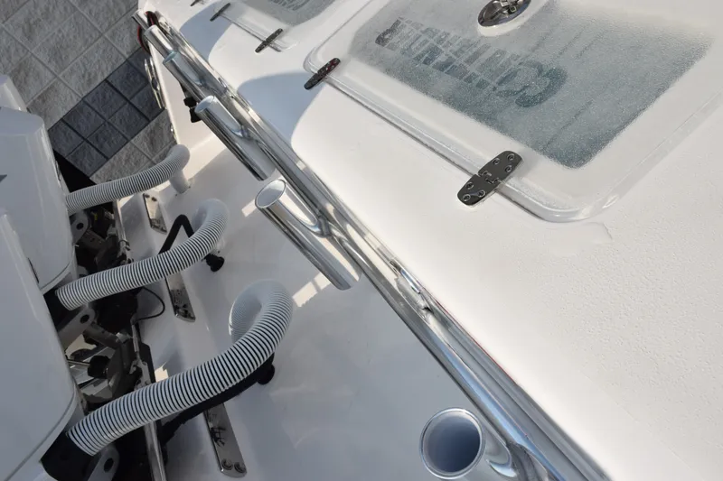 Slide: The Image of 2027 Contender 44 ST boat deck with rod holders and engine hoses. - 54