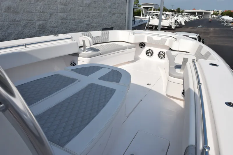 Slide: The Image of 2027 Contender 44 ST boat interior with cushioned seating and sleek design. - 11