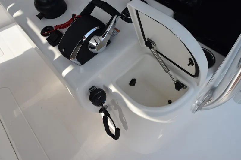 Slide: The Image of Control panel of 2027 Contender 44 ST boat with open storage compartment. - 40