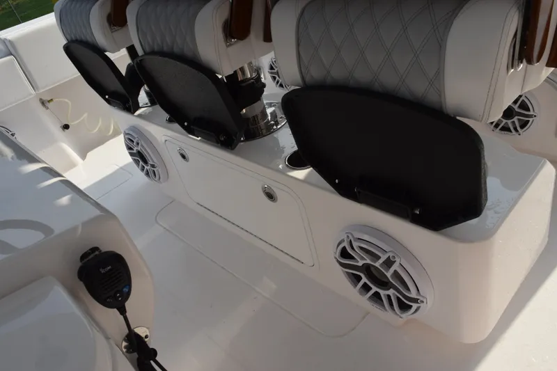 Slide: The Image of Luxury seating and speakers on a 2027 Contender 44 ST boat interior. - 38