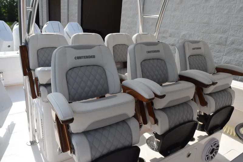 Slide: The Image of Luxury seating on 2027 Contender 44 ST boat, featuring plush, diamond-stitched upholstery. - 9