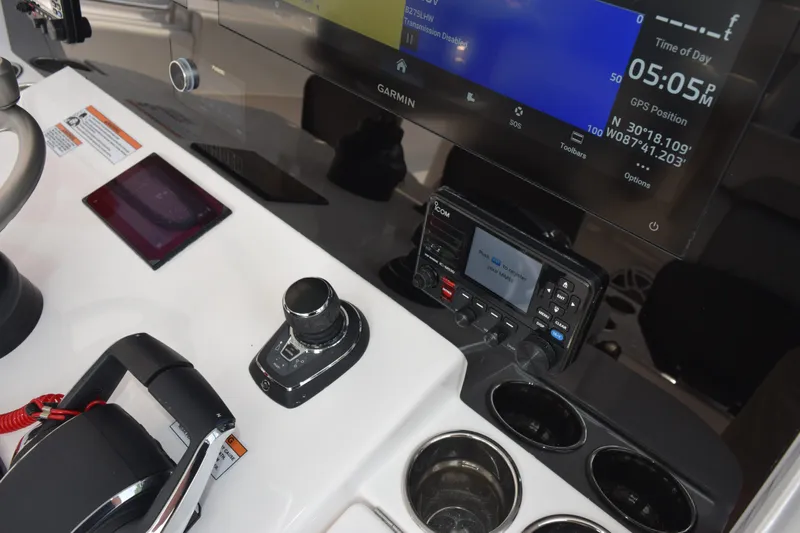 Slide: The Image of 2027 Contender 44 ST boat dashboard with Garmin navigation and control systems. - 41
