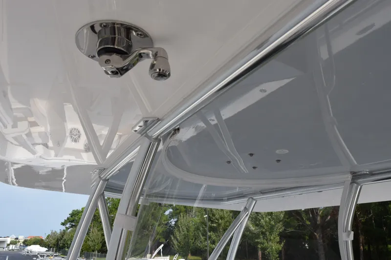 Slide: The Image of 2027 Contender 44 ST boat canopy with stainless steel fittings and clear panels. - 16