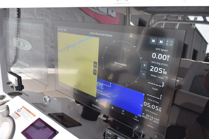 Slide: The Image of Dashboard of a 2027 Contender 44 ST boat with advanced navigation display. - 43