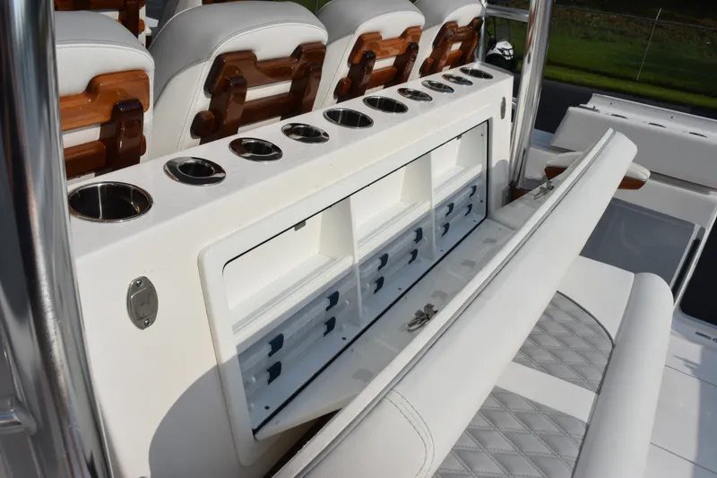 Slide: The Image of 2027 Contender 44 ST boat interior with storage compartments and seating. - 47