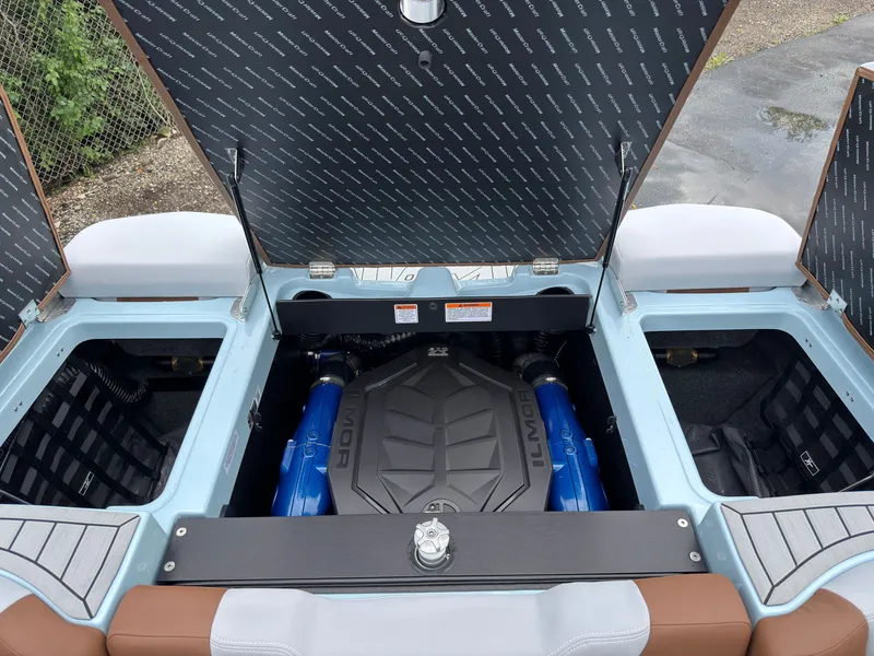 Slide: The Image of The engine compartment of a 2027 MasterCraft XT20 features an Ilmor engine with blue accents. - 19