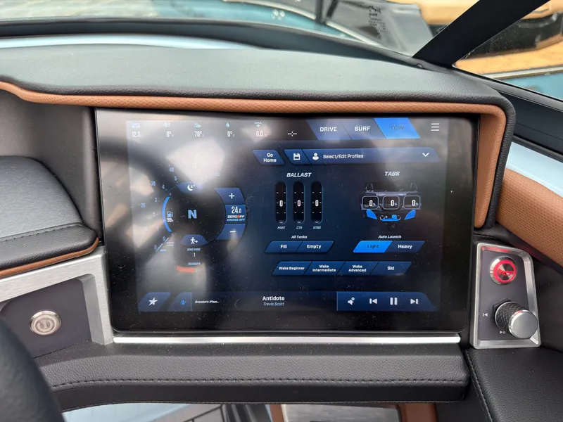 Slide: The Image of The image shows the dashboard of a 2027 MasterCraft XT20 with a modern touchscreen display. - 42