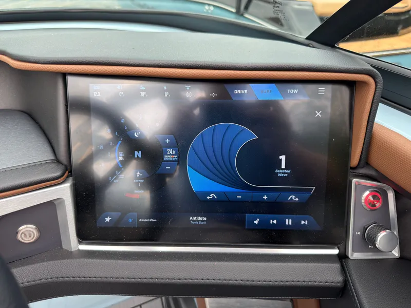 Slide: The Image of The dashboard of a 2027 MasterCraft XT20 features a modern touchscreen display with navigation and audio controls. - 44