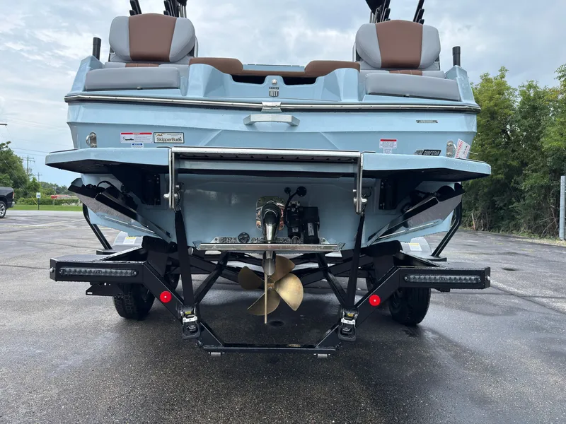 Slide: The Image of The image shows the rear of a 2027 MasterCraft XT20 boat with two seats and a propeller. - 7