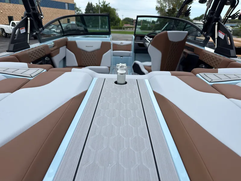 Slide: The Image of The image shows the interior of a 2027 MasterCraft XT20 with brown and white seating. - 14