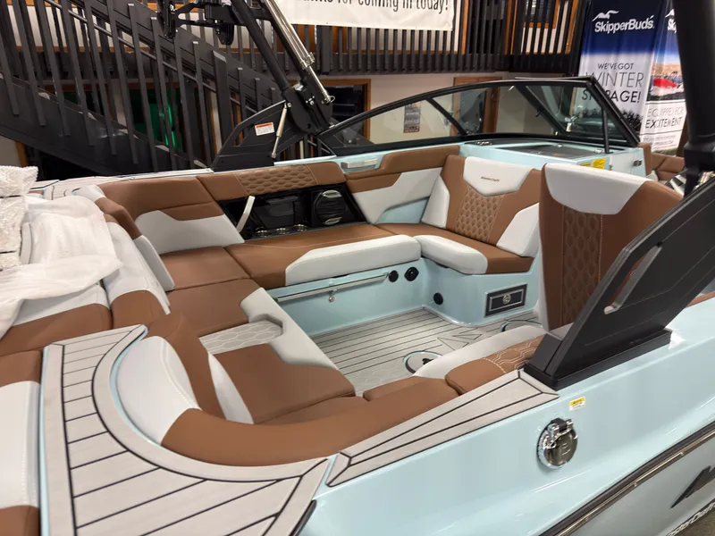 Slide: The Image of The image shows the interior of a 2027 MasterCraft XT20 with sleek brown and white seating. - 1