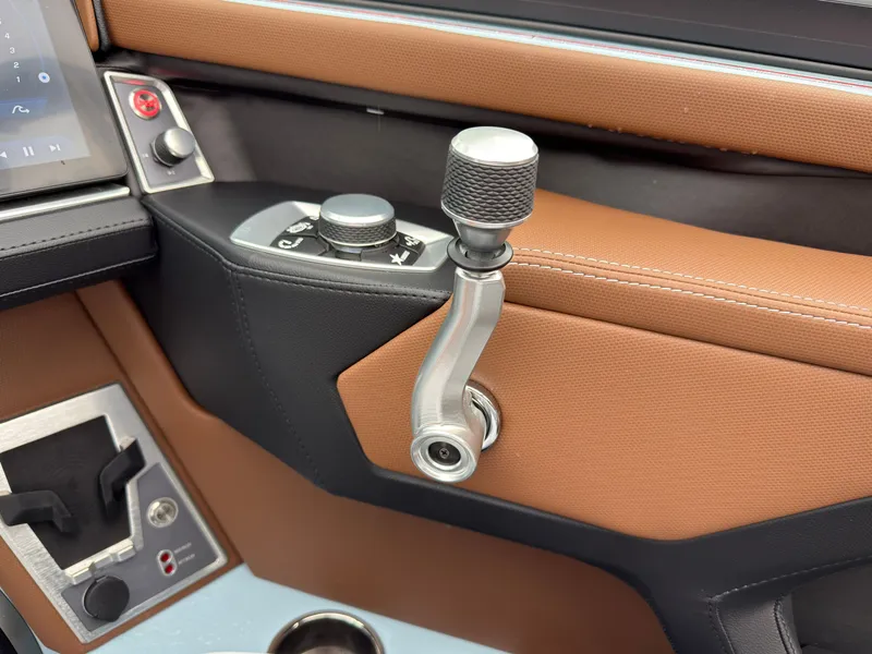 Slide: The Image of Close-up of the throttle lever and controls in a 2027 MasterCraft XT20. - 36
