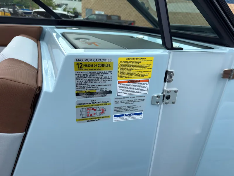 Slide: The Image of Close-up of a boat with capacity labels for 12 persons or 2000 pounds. - 32