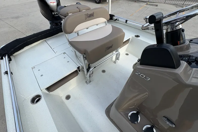 Slide: The Image of 2019 Excel 203 Bay Pro boat interior with seating and steering console. - 17