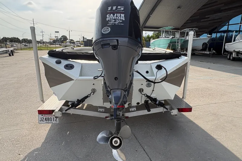 Slide: The Image of 2019 Excel 203 Bay Pro boat with outboard motor on trailer. - 6