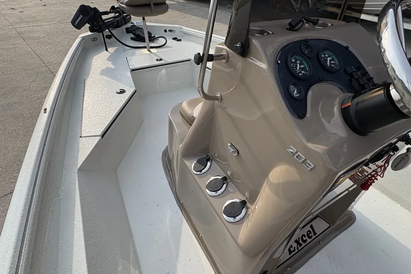 Slide: The Image of 2019 Excel 203 Bay Pro boat interior with steering console and seating. - 20