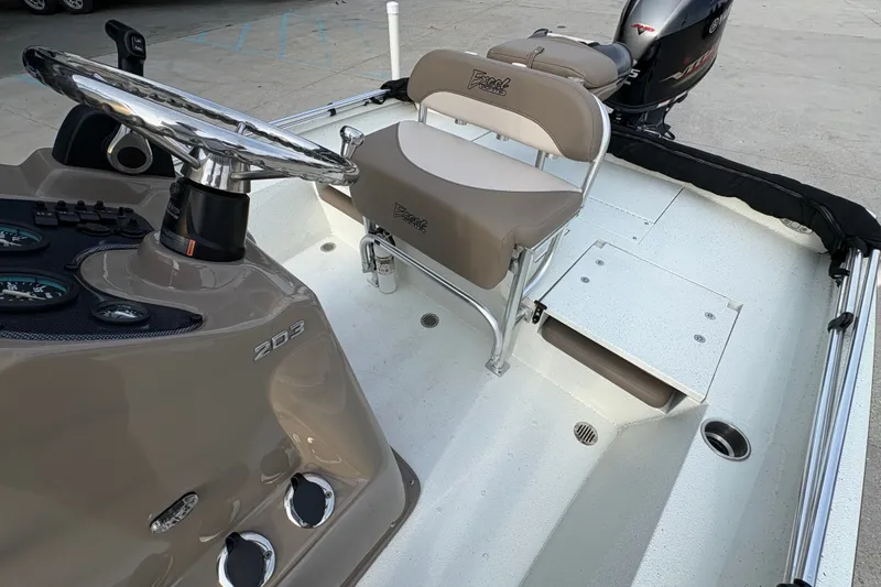 Slide: The Image of 2019 Excel 203 Bay Pro boat interior with steering wheel and seating. - 16