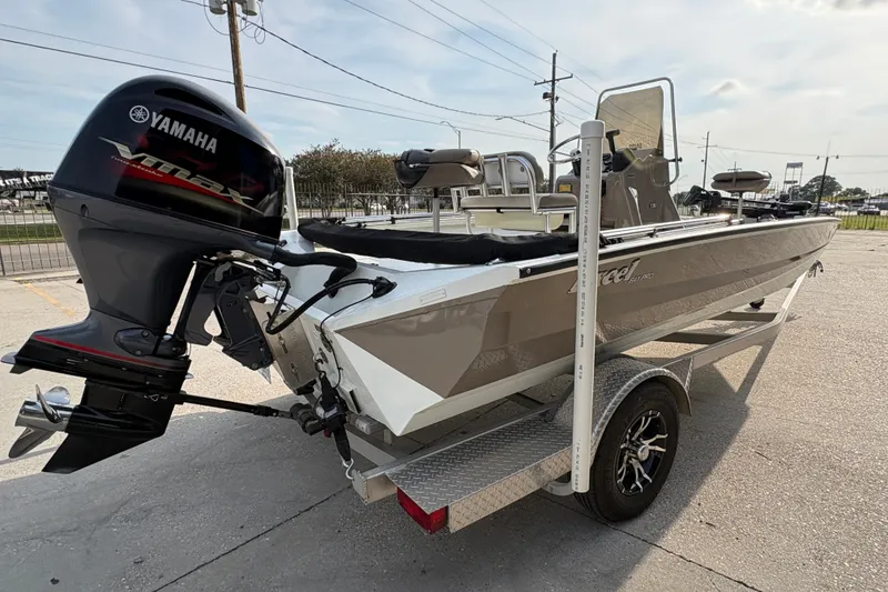 Slide: The Image of 2019 Excel 203 Bay Pro boat with Yamaha outboard motor on trailer. - 5