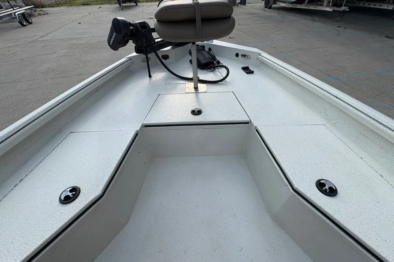 Slide: The Image of 2019 Excel 203 Bay Pro boat interior with seating and storage compartments. - 15