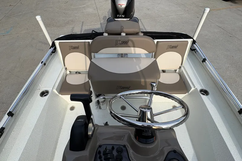 Slide: The Image of 2019 Excel 203 Bay Pro boat interior with steering wheel and seating. - 18