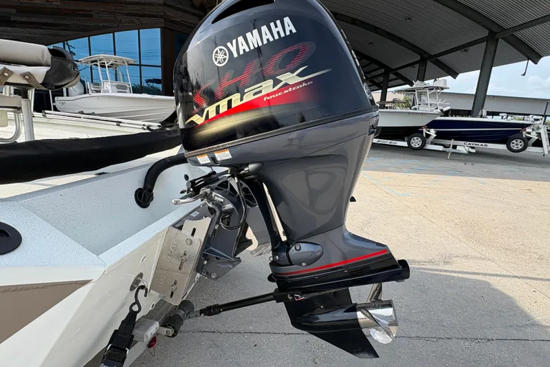 Slide: The Image of 2019 Excel 203 Bay Pro boat with Yamaha outboard motor in a marina setting. - 7