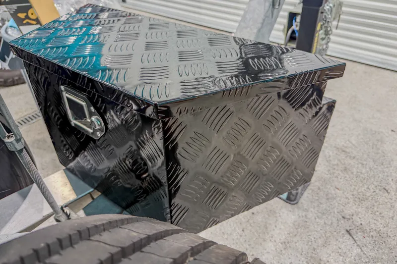 Slide: The Image of Black metal storage box with diamond plate pattern on a Sea Fox 288 Commander, 2022 model. - 20