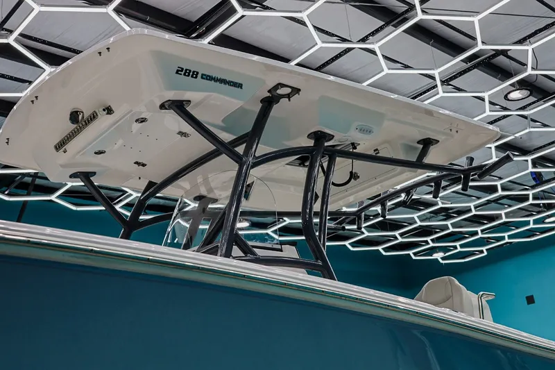 Slide: The Image of 2022 Sea Fox 288 Commander boat under modern hexagonal ceiling lights. - 9