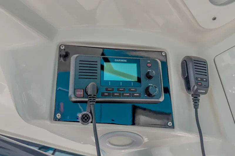 Slide: The Image of Garmin marine radio system on 2022 Sea Fox 288 Commander boat dashboard. - 13