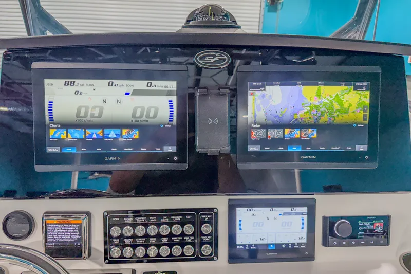 Slide: The Image of Dashboard of a 2022 Sea Fox 288 Commander with Garmin navigation displays. - 12