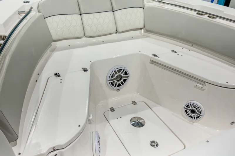 Slide: The Image of 2022 Sea Fox 288 Commander boat interior with white seating and built-in speakers. - 14