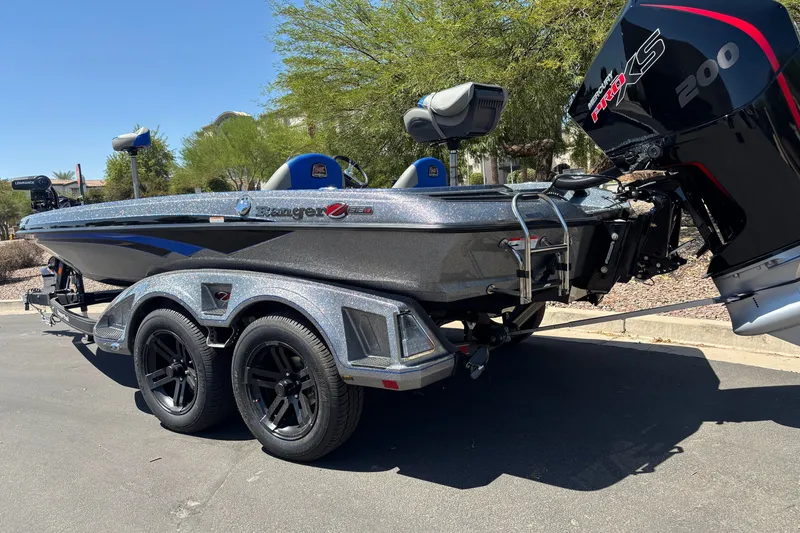 Slide: The Image of 2027 Ranger Z518 Cup-Equipped boat with dual axle trailer and powerful outboard motor. - 2