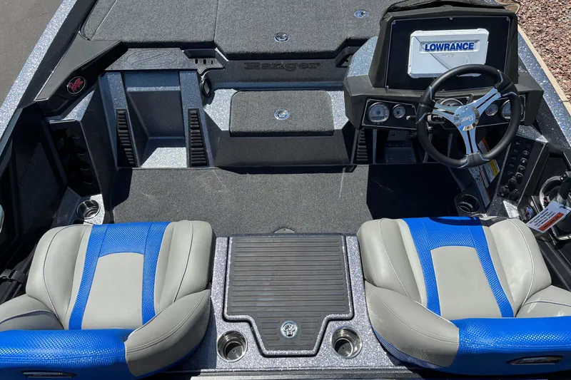 Slide: The Image of 2027 Ranger Z518 Cup-Equipped boat interior with blue and gray seats, steering wheel, and Lowrance display. - 7