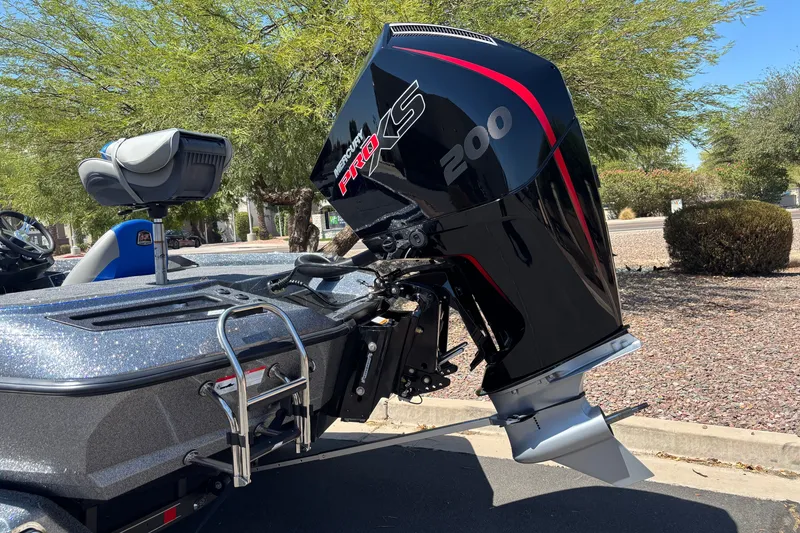 Slide: The Image of 2027 Ranger Z518 Cup-Equipped boat with Mercury Pro XS 200 engine in sunny outdoor setting. - 3