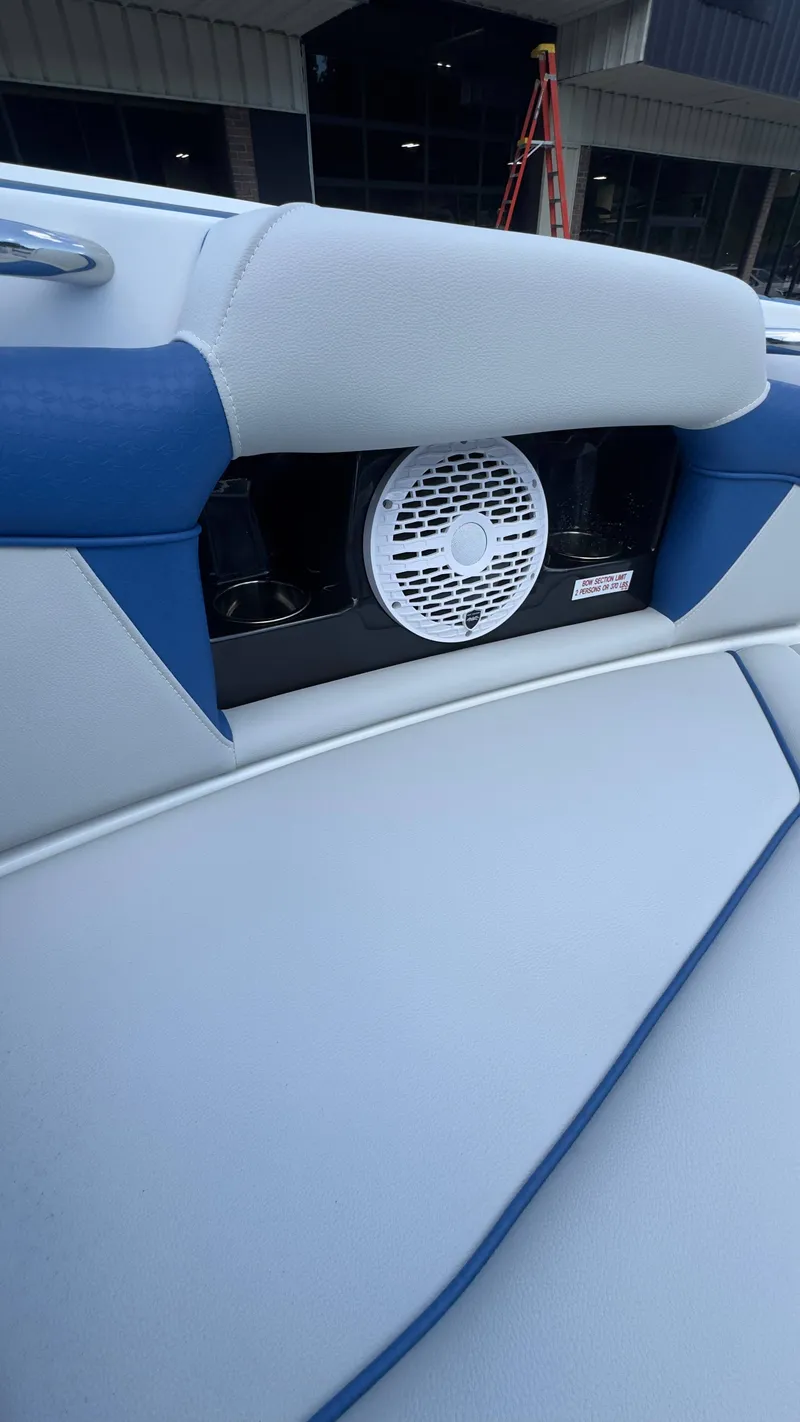 Slide: The Image of Close-up of a speaker in a 2022 Supreme S220 boat, integrated into the upholstery. - 13