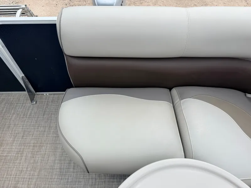 Slide: The Image of Seating area of a 2016 Premier 220 SunSpree pontoon boat with two-tone upholstery. - 32