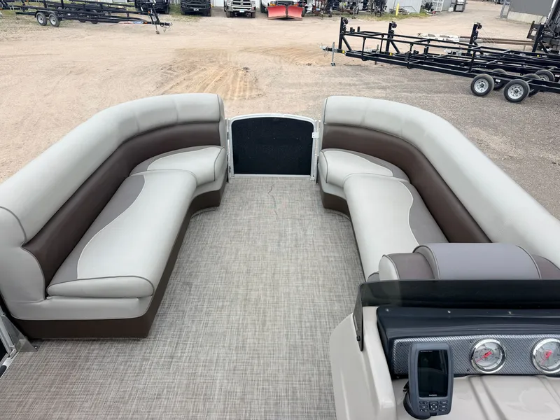 Slide: The Image of The image shows the interior of a Premier 220 SunSpree pontoon boat with beige and brown seating. - 3