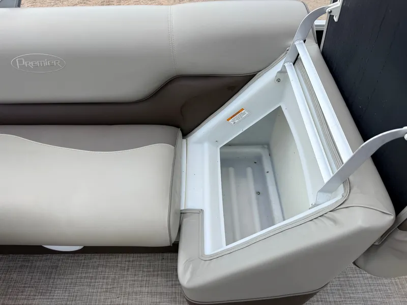 Slide: The Image of A seating area on a boat with an integrated storage compartment beneath the seat. - 29