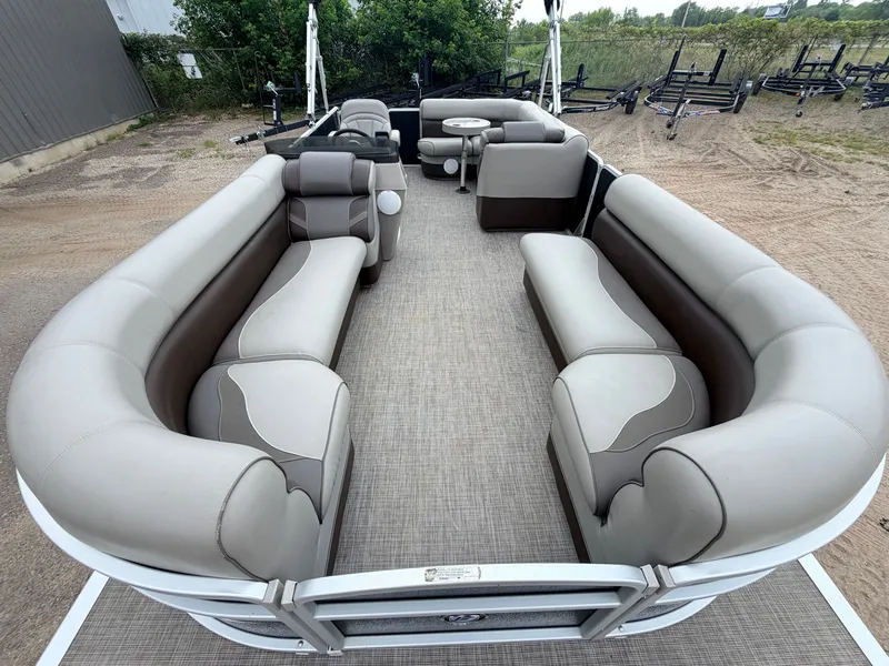 Slide: The Image of The image shows the spacious deck of a Premier 220 SunSpree pontoon boat with comfortable seating. - 2