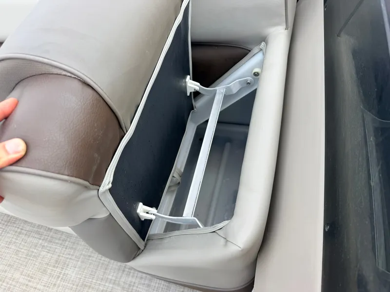 Slide: The Image of A boat seat with an open storage compartment underneath. - 17